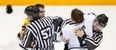 Throttled ice hockey player accidentally punches linesman in the face