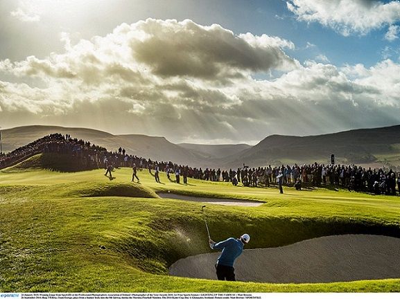 23 January 2015; Winning image from Sportsfile at the Professional Photographers Association of Ireland - Photographer of the Year Awards 2015. 1st Prize Sports Feature - LIGHTING UP THE FAIRWAY - Matt Browne. 26 September 2014; Rory McIlroy, Team Europe, plays from a bunker back onto the 8th fairway during the Morning Fourball Matches. The 2014 Ryder Cup, Day 1. Gleneagles, Scotland. Picture credit: Matt Browne / SPORTSFILE