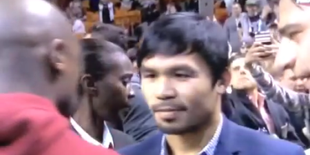 Manny Pacquiao and Floyd Mayweather exchange pleasantries at NBA game