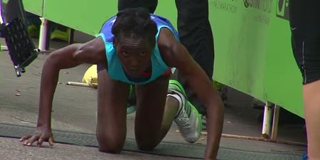 Video: Marathon race leader collapses and crawls agonisingly to finish line