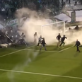 Video: Athens derby delayed after fans storm pitch and attack Olympiakos players