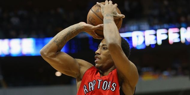 DALLAS, TX - FEBRUARY 24:  DeMar DeRozan #10 of the Toronto Raptors takes a shot against the Dallas Mavericks at American Airlines Center on February 24, 2015 in Dallas, Texas.  NOTE TO USER: User expressly acknowledges and agrees that, by downloading and or using this photograph, User is consenting to the terms and conditions of the Getty Images License Agreement.  (Photo by Ronald Martinez/Getty Images)
