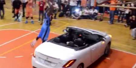 Video: Man tries to dunk a basketball over a car, fails miserably