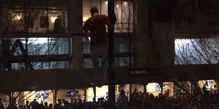 Video: Wisconsin fan climbs into streetlight and jumps into riotous crowd after NCAA basketball final defeat