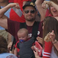 Video: Baseball fan catches foul ball one handed with a baby strapped to his chest