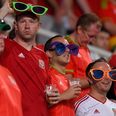 This Welsh fan may very well be the most sunburnt man ever at a football game