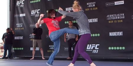 WATCH: Holly Holm lets fan repeatedly kick her in the gut ahead of Ronda Rousey fight