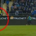 WATCH: Footballer snaps and hurls corner flag at opposition fans who threw banger at him
