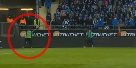 WATCH: Footballer snaps and hurls corner flag at opposition fans who threw banger at him