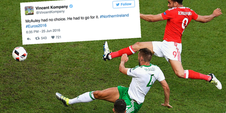 People rally around Gareth McAuley after his own goal knocked Northern Ireland out