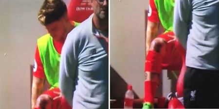 WATCH: Alberto Moreno enrages Liverpool fans by flipping a bottle on subs bench