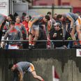 WATCH: Castlebar Mitchels players forced to jump wall to get onto pitch