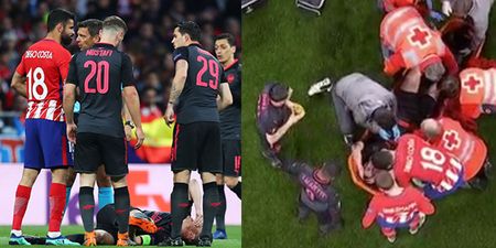 Diego Costa consoles Laurent Koscielny after he wails on the ground in pain
