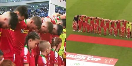 Cliftonville players keep their heads bowed during God Save the Queen before Irish Cup final against Coleraine