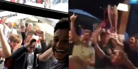 Alex Oxlade-Chamberlain is mobbed by fans while Carragher sings Salah song