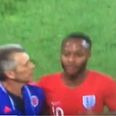 Colombia assistant barges Raheem Sterling as he leaves the pitch