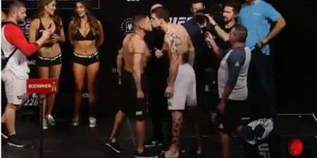 UFC fighters kiss on stage