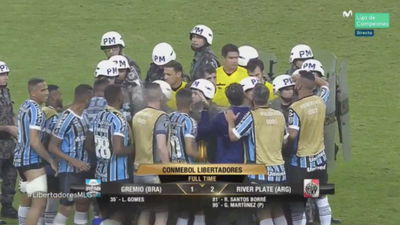 Referee protected by riot police after controversial end to Copa Libertadores semi-final