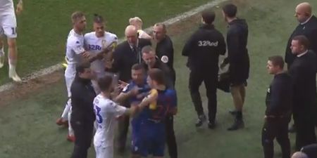 Leeds United’s Mateusz Klich squirts water down opponent’s back during melee