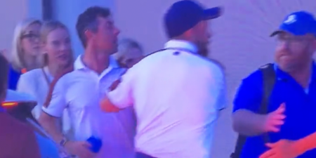 Shane Lowry forced to drag Rory McIlroy away from heated argument after 18th drama